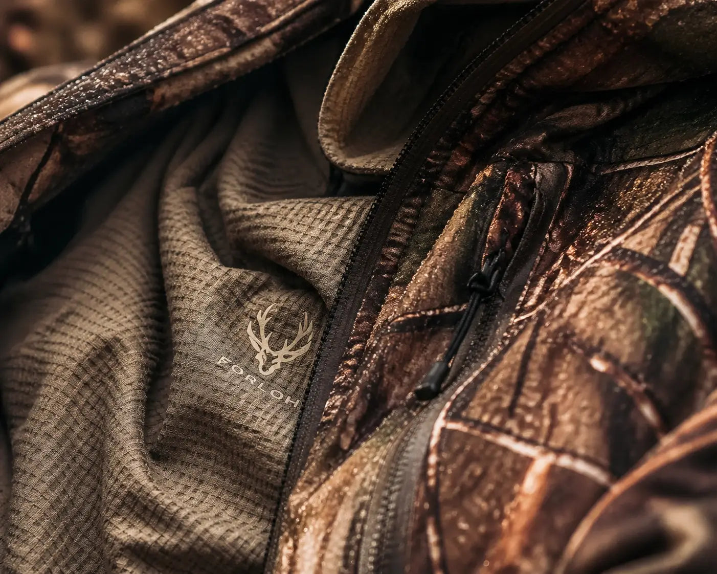 Protective layering of camouflage hunting apparel designed for cold weather outdoor comfort.