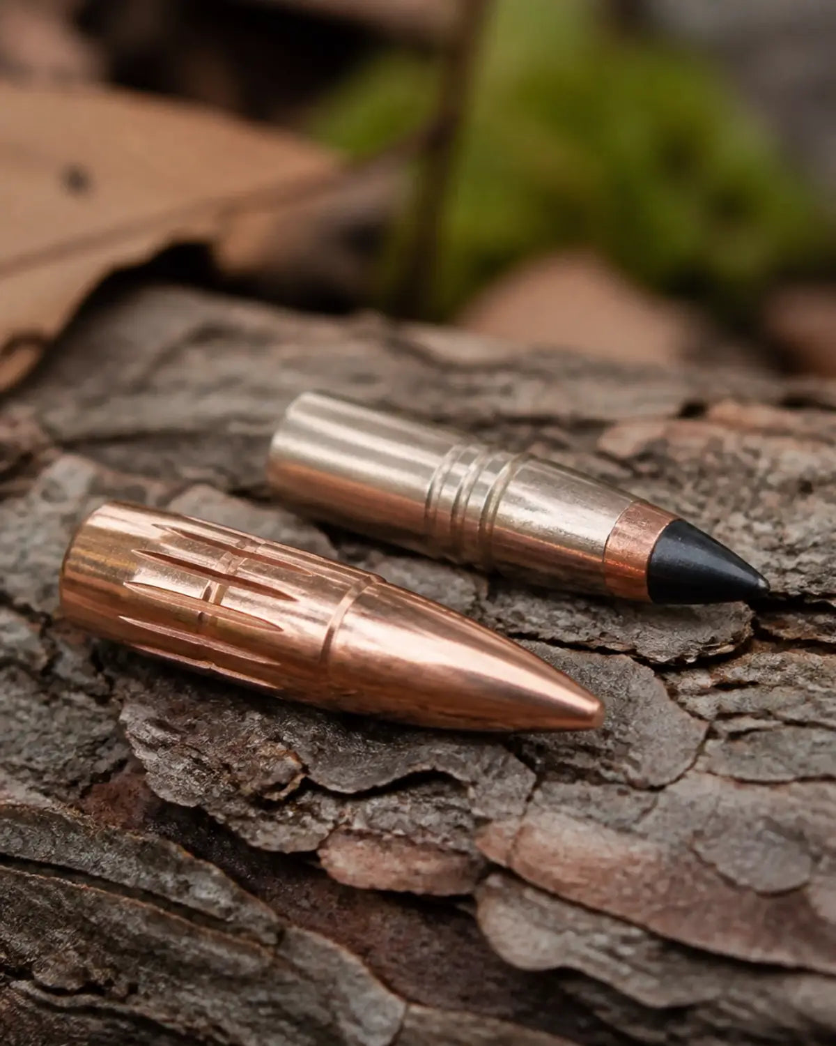 Close-up of premium hunting bullet types on natural wood